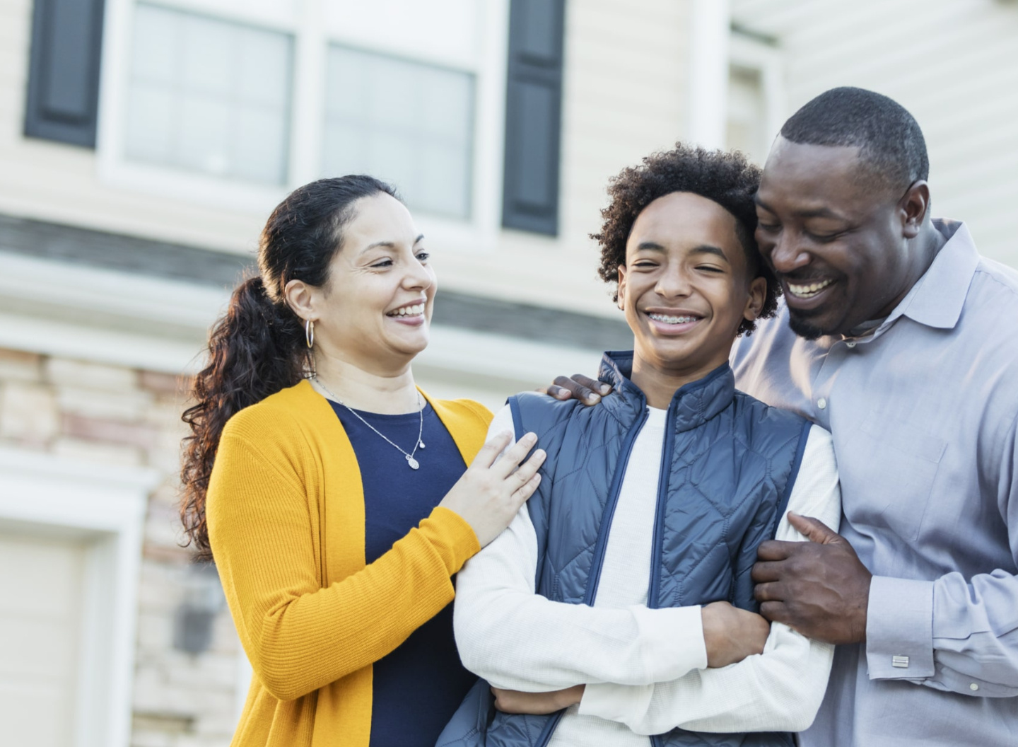 Happy co-parenting family smiling together